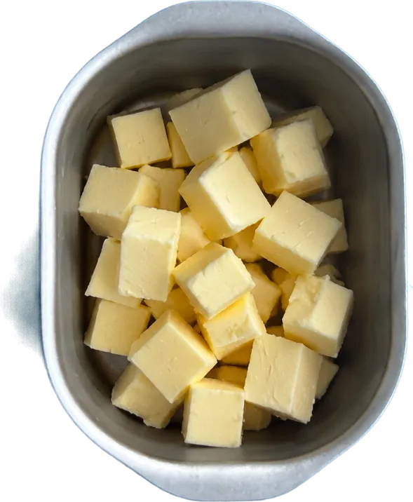 Nel quarto contenitore mettete 70 g di burro a dadini piccoli.